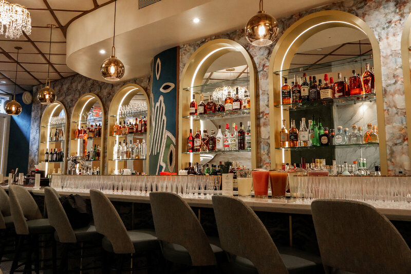 View of bar with cocktails on the bar top